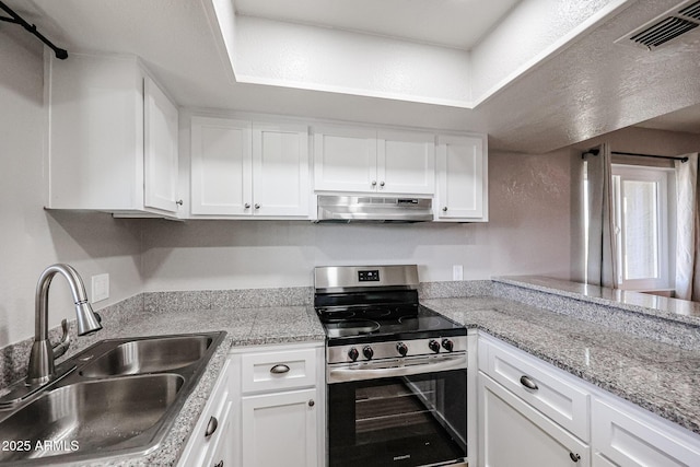 kitchen featuring white cabinetry, sink, and stainless steel stove