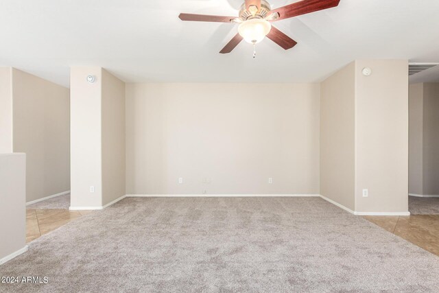 carpeted empty room with ceiling fan