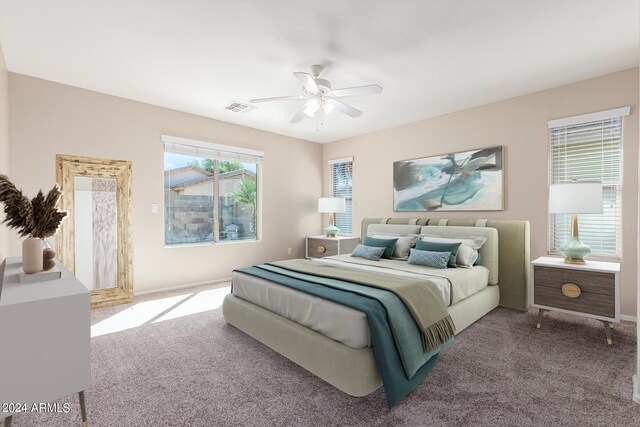 bedroom with ceiling fan and carpet floors