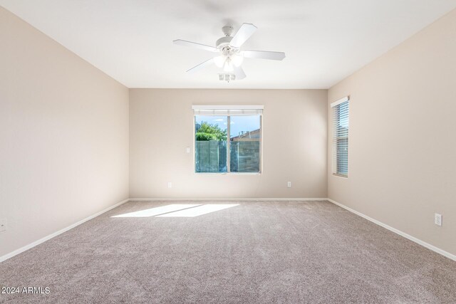 spare room with carpet flooring and ceiling fan