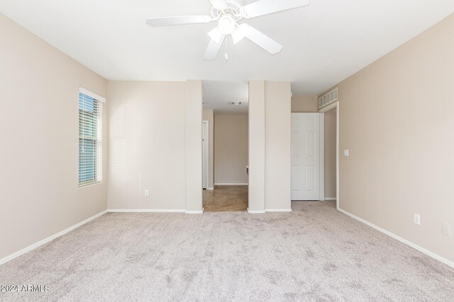 unfurnished bedroom featuring ceiling fan and light colored carpet