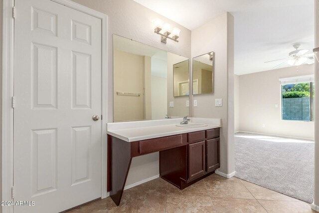 bathroom featuring ceiling fan, vanity, and tile patterned floors