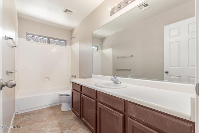 full bathroom featuring vanity, tile patterned floors, toilet, and shower / bathtub combination