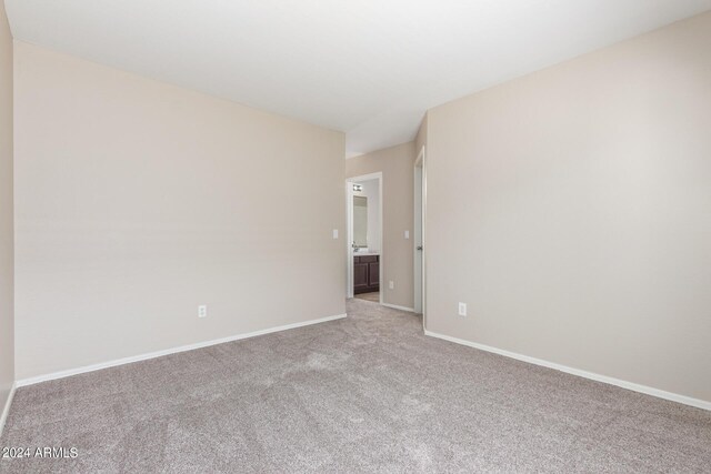 empty room with light colored carpet