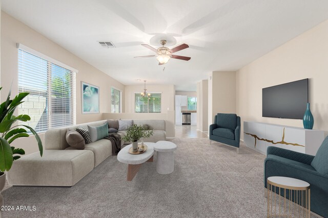 carpeted living room featuring ceiling fan