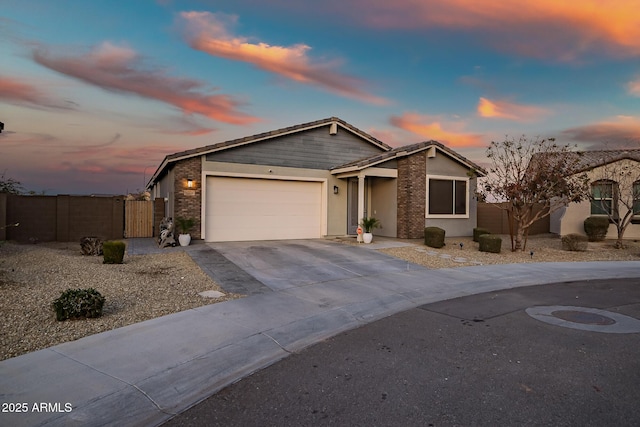 ranch-style home featuring a garage