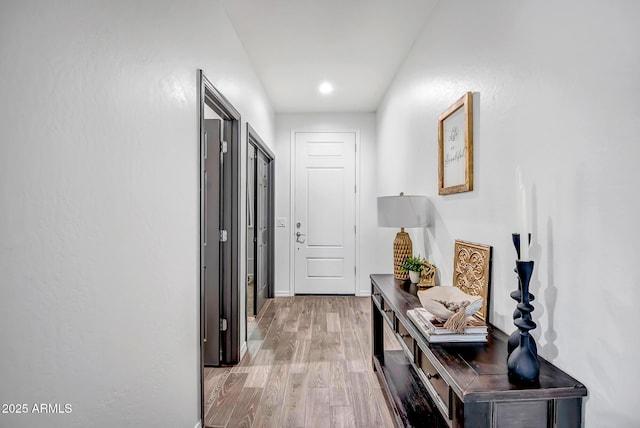 hall with light hardwood / wood-style flooring