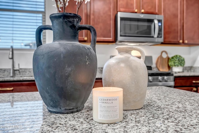 room details with light stone counters and sink