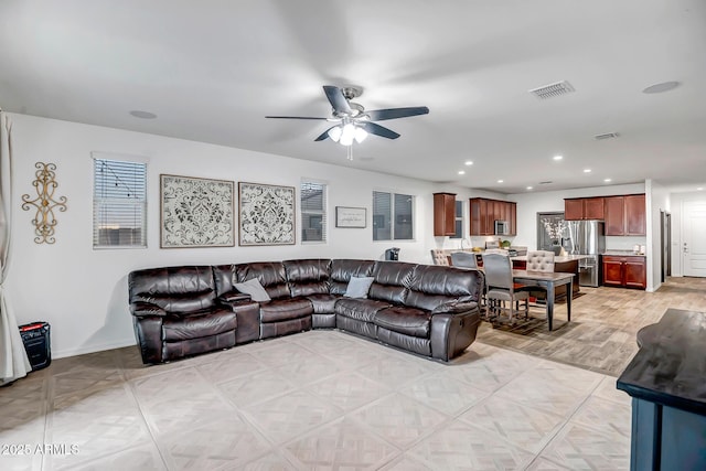 living room featuring ceiling fan