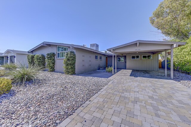 view of front of property with a carport