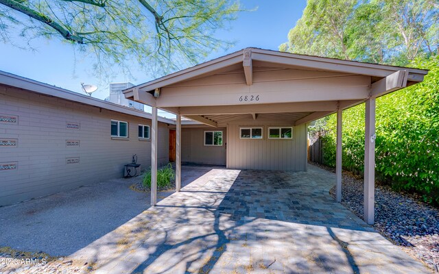 view of front facade with a carport