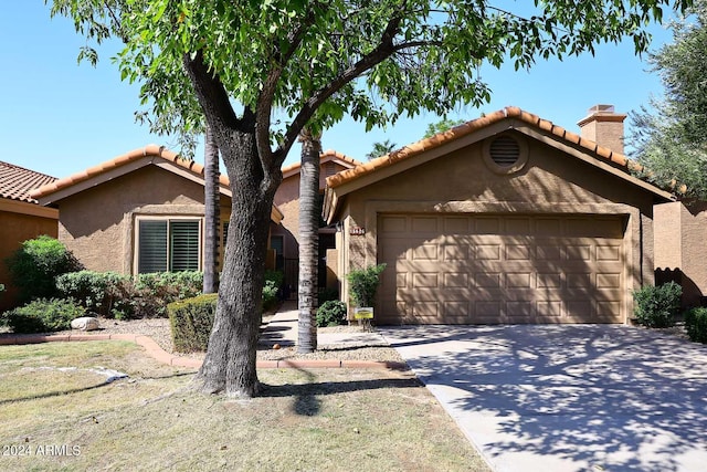 ranch-style home featuring a garage