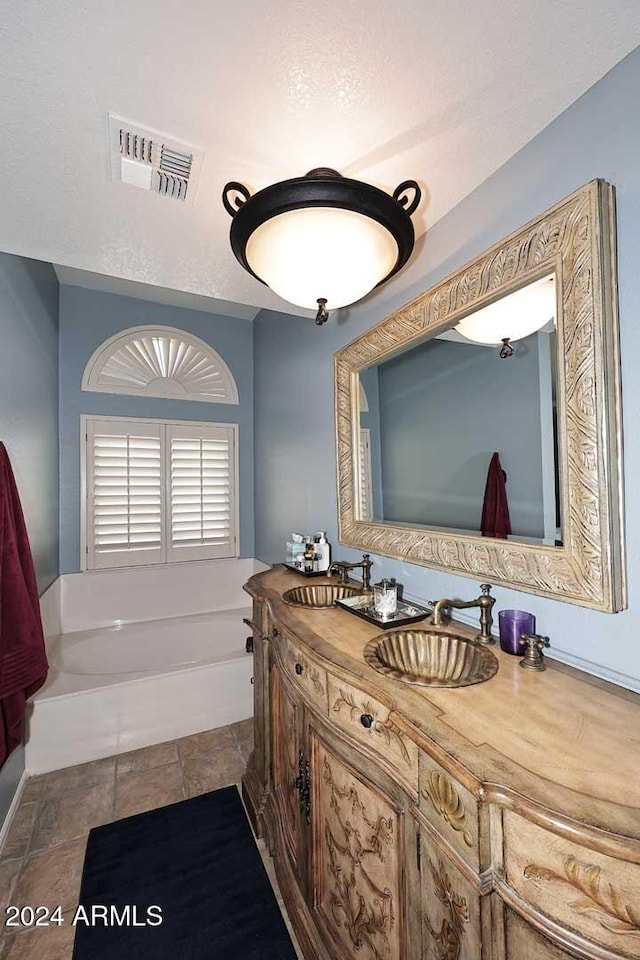 bathroom with vanity and a tub to relax in