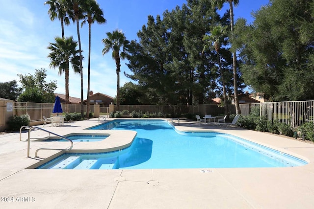 view of swimming pool with a patio area