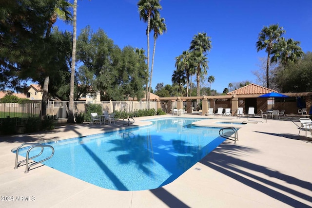 view of swimming pool featuring a patio area