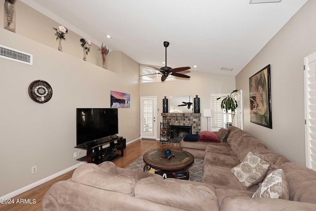 living room featuring ceiling fan, wood-type flooring, and plenty of natural light