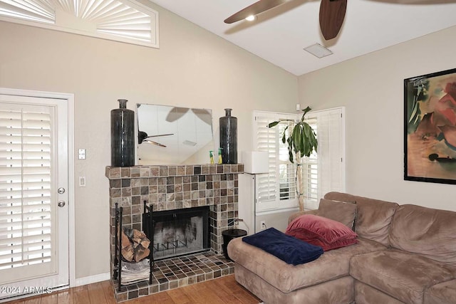 living room featuring wood-type flooring and lofted ceiling