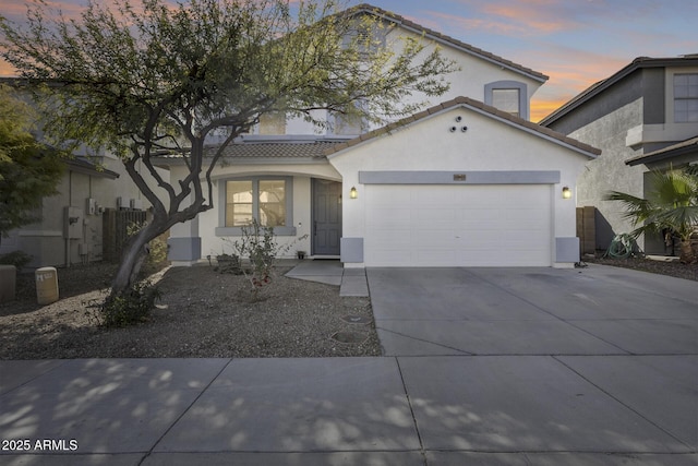 view of front of property with a garage