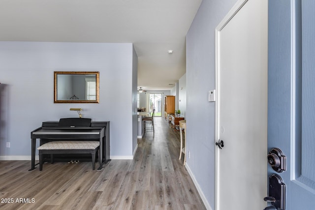 hall with light hardwood / wood-style floors