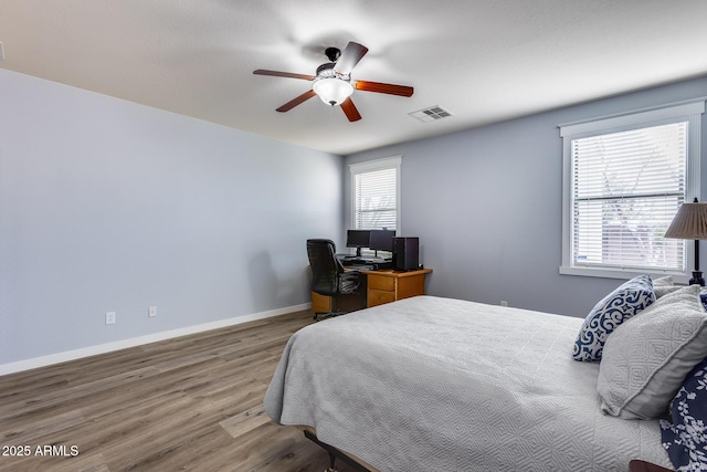 bedroom featuring hardwood / wood-style flooring and ceiling fan