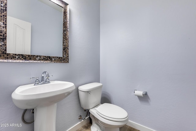 bathroom with sink and toilet