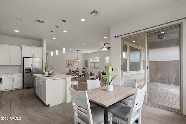 dining room with recessed lighting, visible vents, and ceiling fan