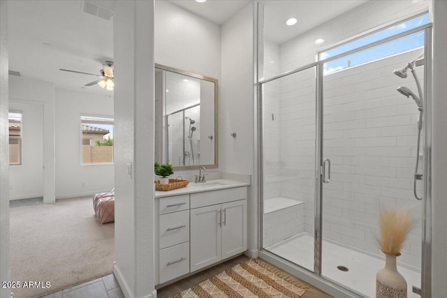 bathroom with vanity, a ceiling fan, visible vents, recessed lighting, and a stall shower