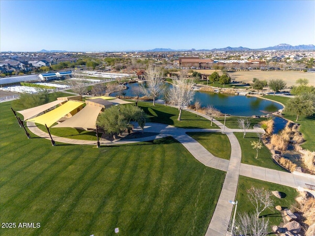 drone / aerial view with a water and mountain view