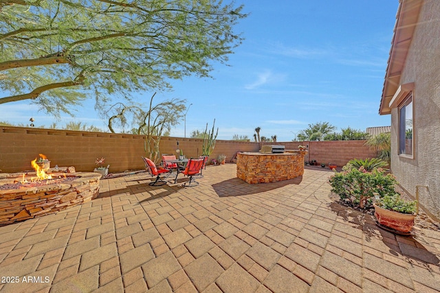 8687 W Bajada Rd, Peoria, AZ 85383 - fenced backyard featuring an outdoor fire pit, a patio, and a grill