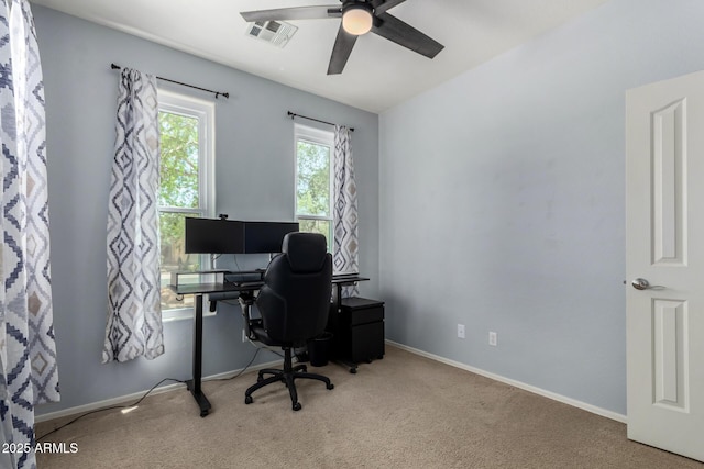 home office with carpet floors, ceiling fan, visible vents, and baseboards