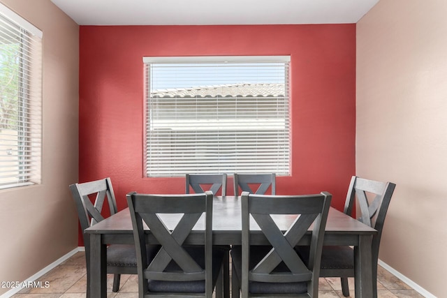 dining area with baseboards and a wealth of natural light