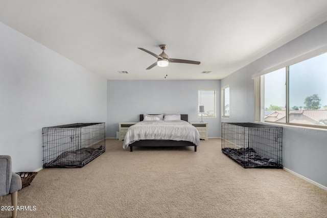 bedroom with visible vents, carpet flooring, baseboards, and a ceiling fan