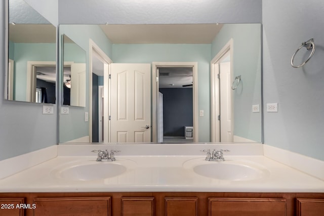 bathroom featuring double vanity and a sink