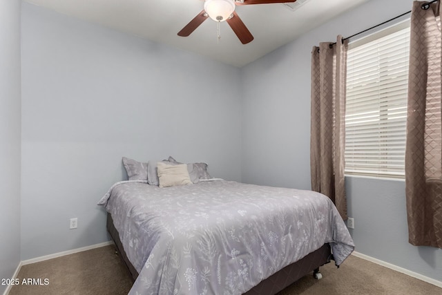carpeted bedroom with baseboards and ceiling fan
