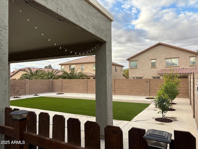 view of yard with a fenced backyard and a patio area