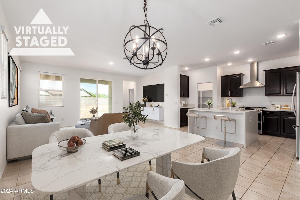 dining room featuring an inviting chandelier and light tile patterned flooring