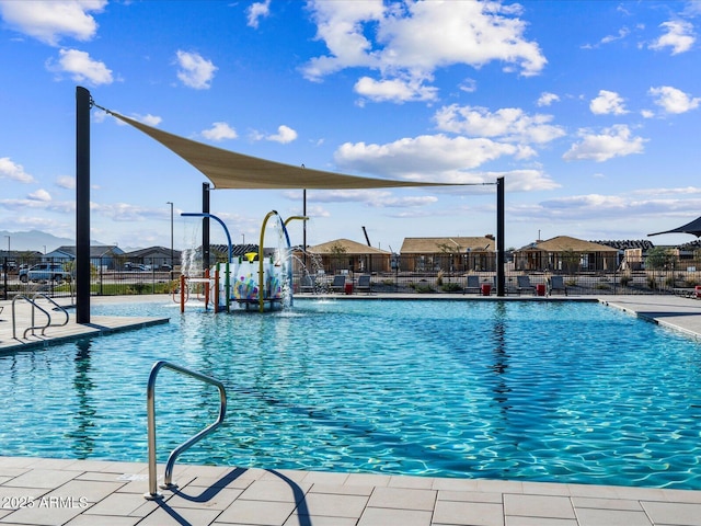 view of pool with pool water feature