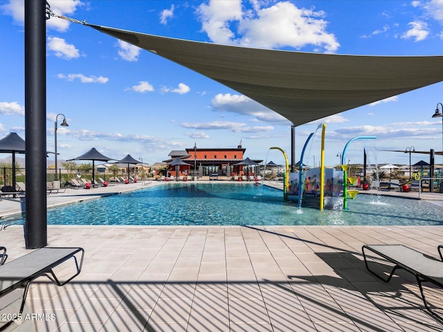 view of pool featuring a patio and pool water feature