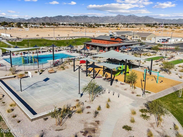 birds eye view of property with a mountain view