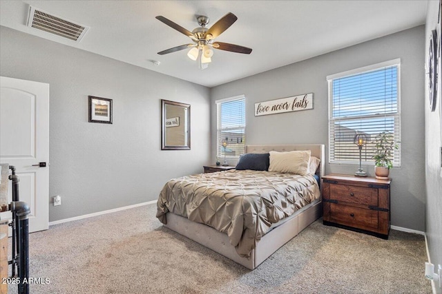 carpeted bedroom featuring ceiling fan, baseboards, and visible vents