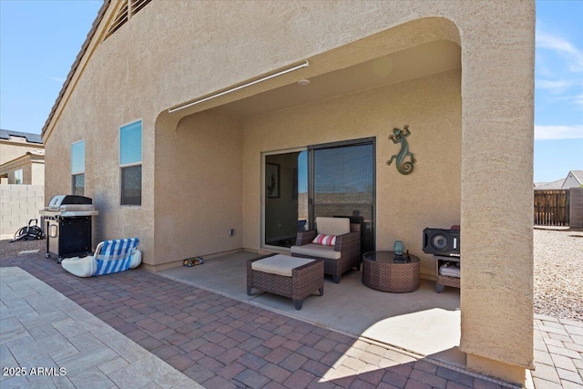 view of patio / terrace featuring grilling area and fence