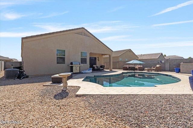 view of swimming pool featuring cooling unit, a grill, a fenced backyard, a patio area, and a fenced in pool