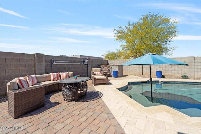 view of patio with outdoor lounge area, a fenced backyard, and a fenced in pool