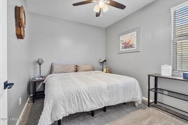 bedroom with baseboards, a ceiling fan, and carpet floors