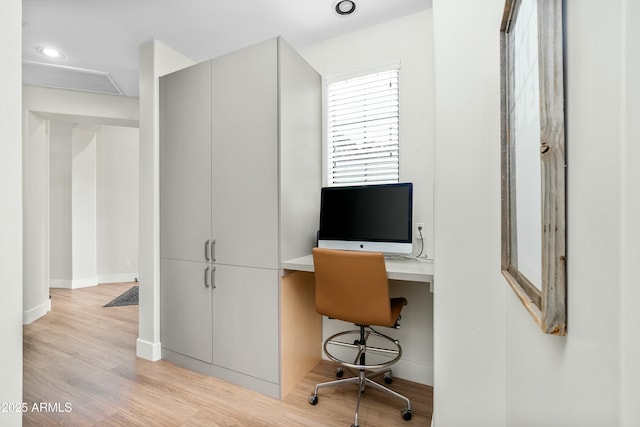 office space featuring recessed lighting, baseboards, and light wood finished floors