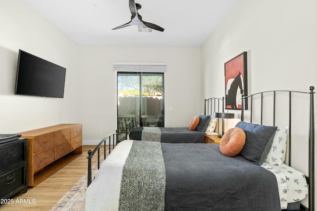 bedroom with access to exterior, light wood finished floors, baseboards, and ceiling fan