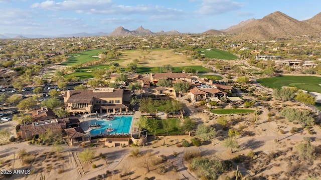 drone / aerial view with a mountain view, a residential view, and golf course view