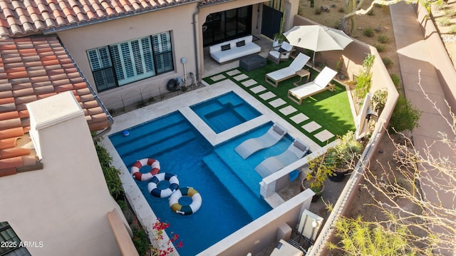 view of pool with a patio area and a fenced backyard