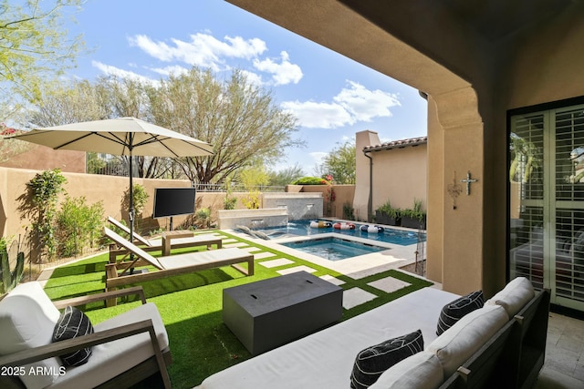 view of swimming pool with an outdoor living space, a patio, a fenced backyard, a fenced in pool, and an in ground hot tub