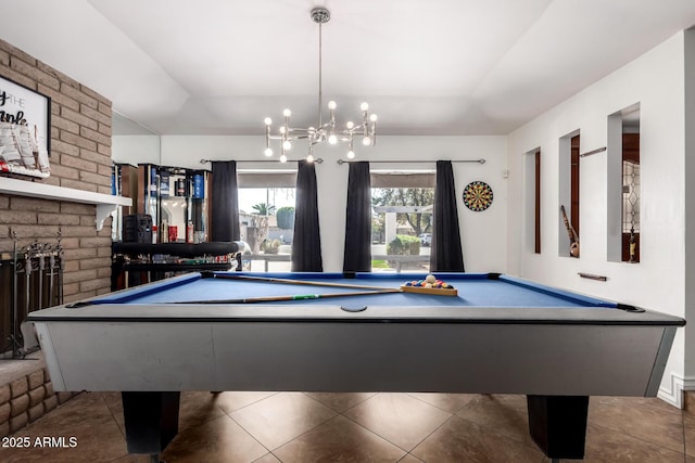 playroom featuring dark tile patterned flooring, a tray ceiling, a fireplace, and billiards